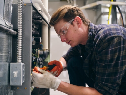 technician working on a furnace